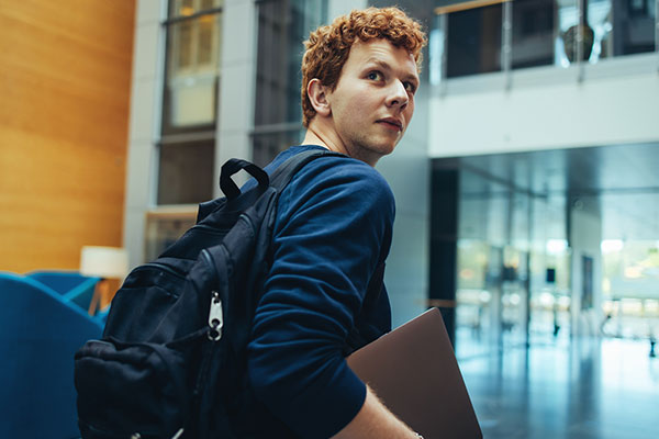 Student walking through school.