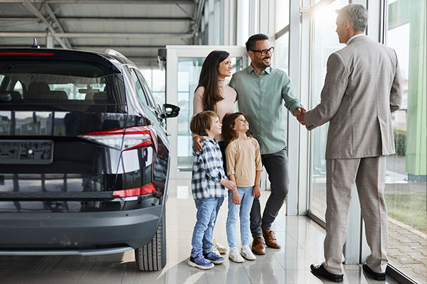Family purchasing a new car.