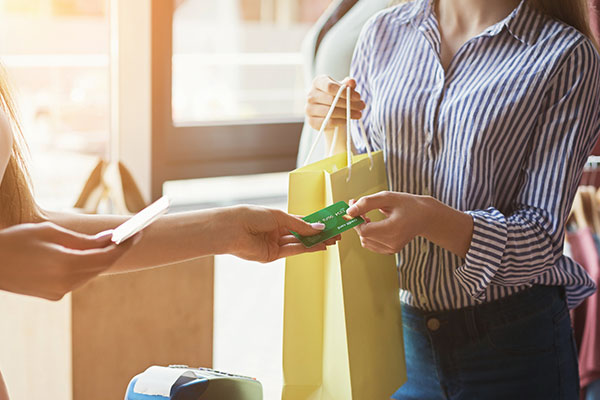 Person using their gift card for shopping.