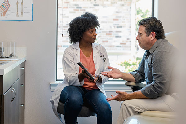 Doctor meeting with a patient.