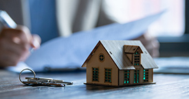 Person signing a document for a mortgage loan.