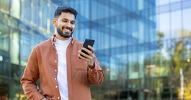 Hispanic man on his phone 