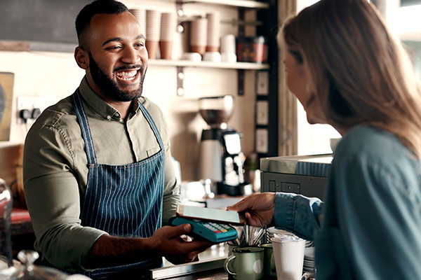 Person paying for their coffee with their phone.