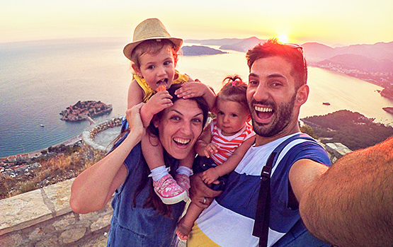 Family smiling on vacation.