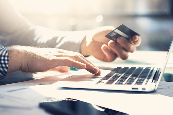 Business owner using a debit card to make a purchase.