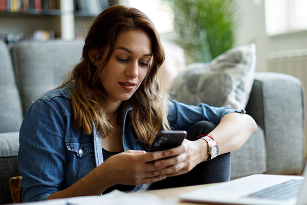 Person using their phone to contact their bank.