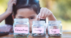 Child and savings jars image